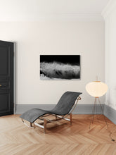 Modern interior with a chaise lounge, floor lamp, and abstract art on the wall.