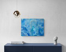 Blue abstract painting on a white wall above a dark blue console table.